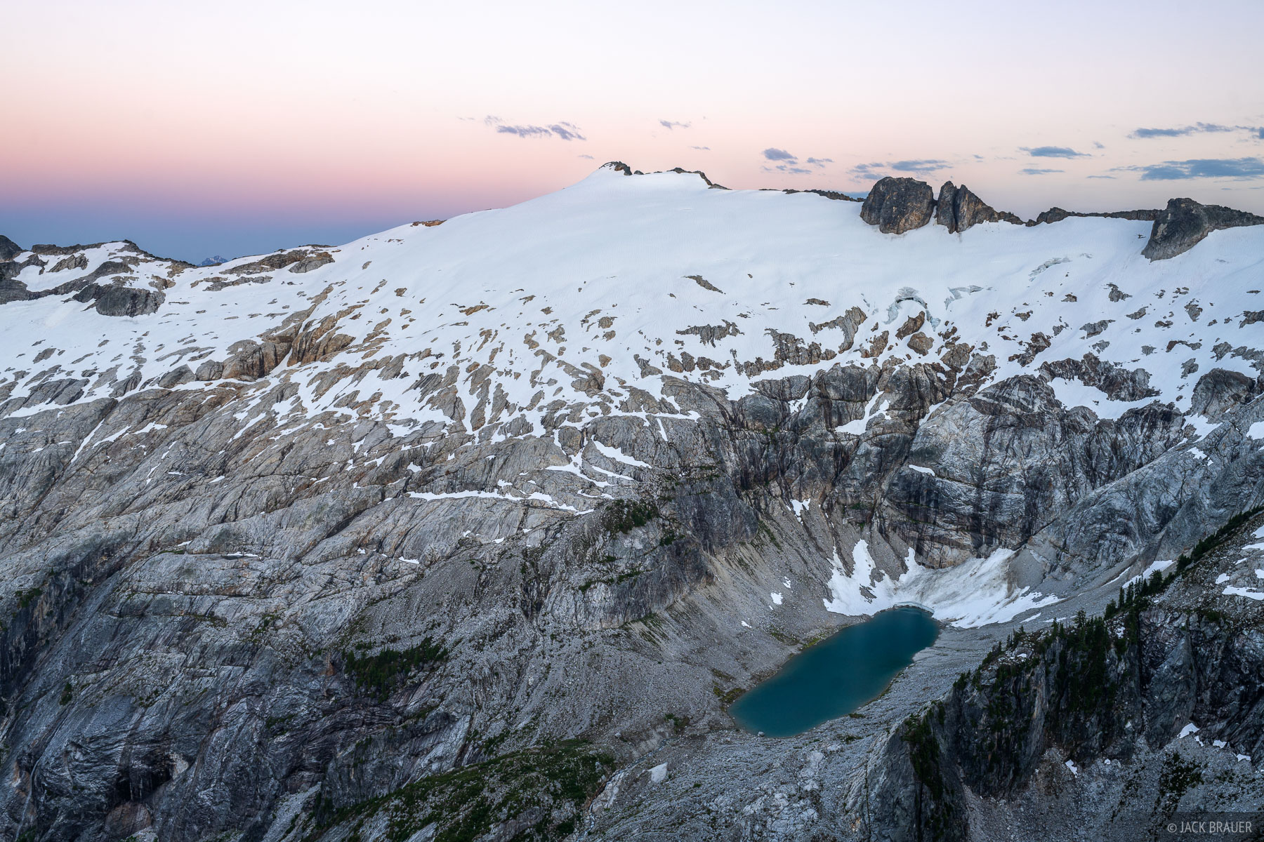 Mutchler Peak Mutchler Peak and its receding glacier under a sunset sky.