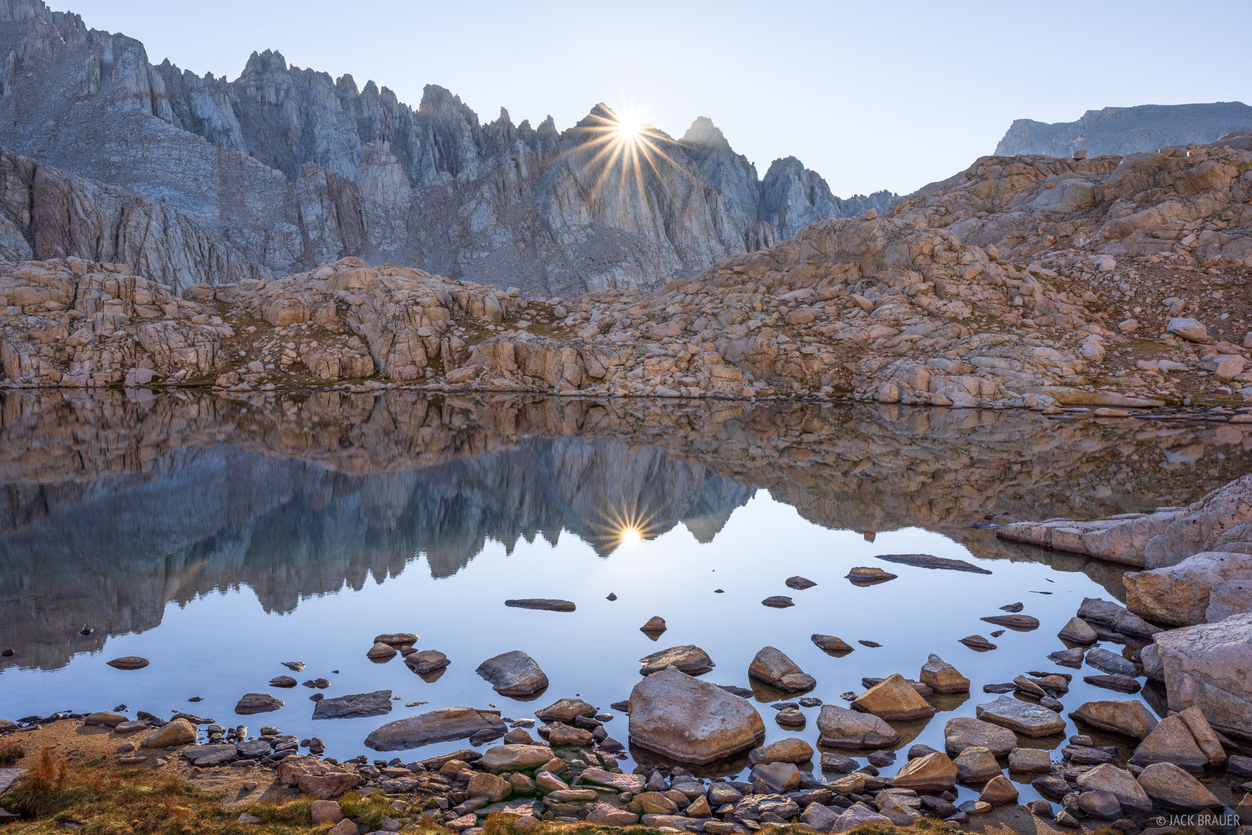 Miter Basin Sunstars The morning sun pokes over a jagged ridgeline in Miter Basin.