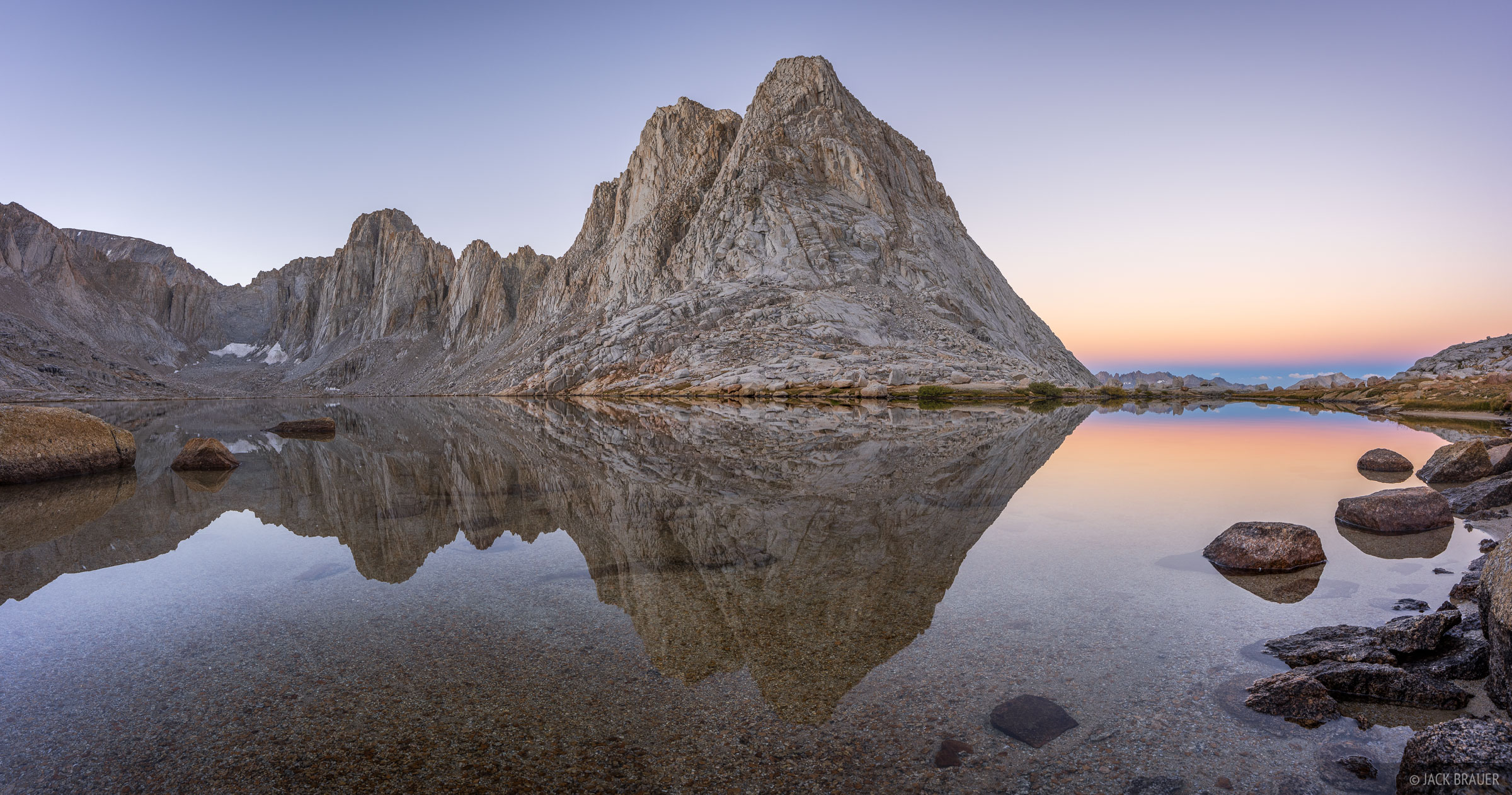 Wales Lake Sunrise Reflection A perfect reflection of rugged peaks on a calm morning at Wales Lake.