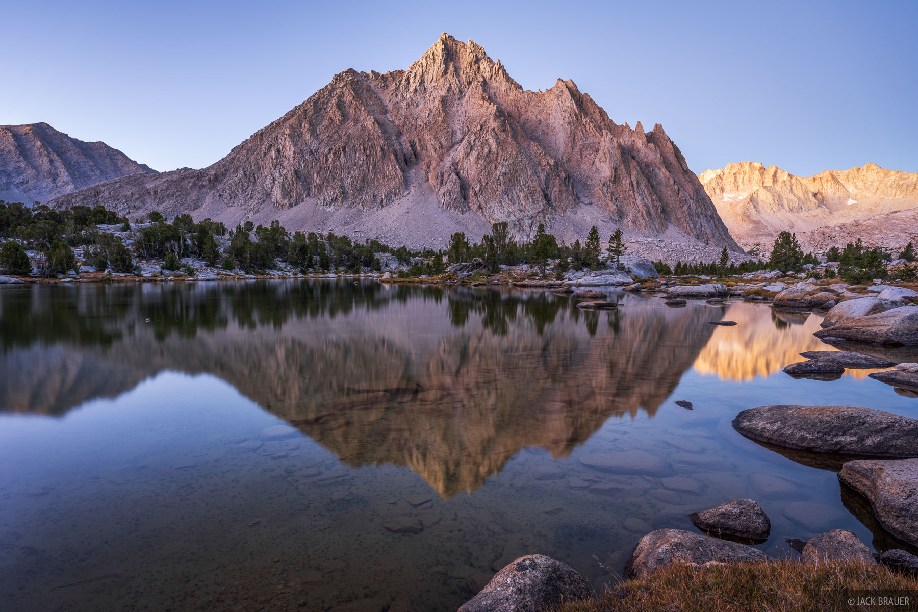 Center Reflection Center Peak (12,730 ft) reflects in a lake before sunrise.