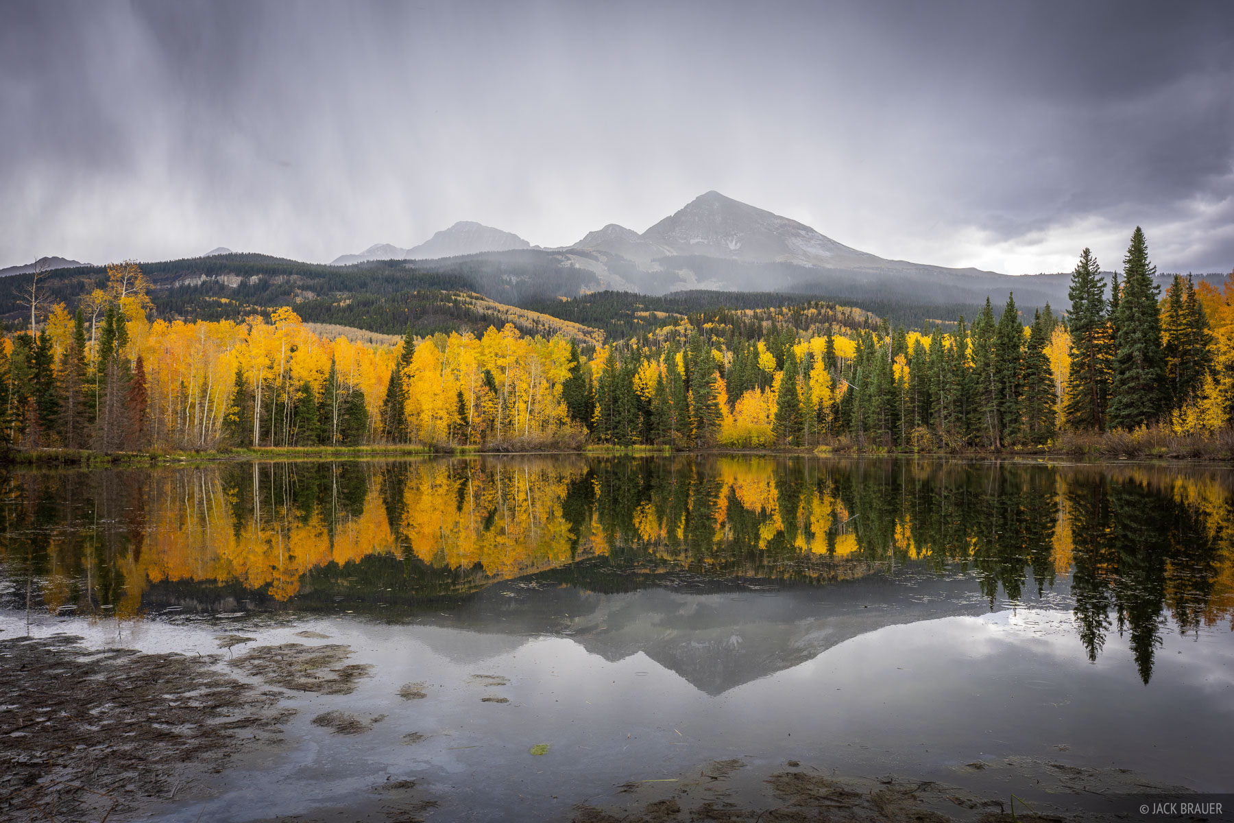 Boskoff Stormy Reflection Boskoff Peak (13,123 ft) reflects in a lake as a thunderstorm rolls over in the San Juan Mountains of Colorado.